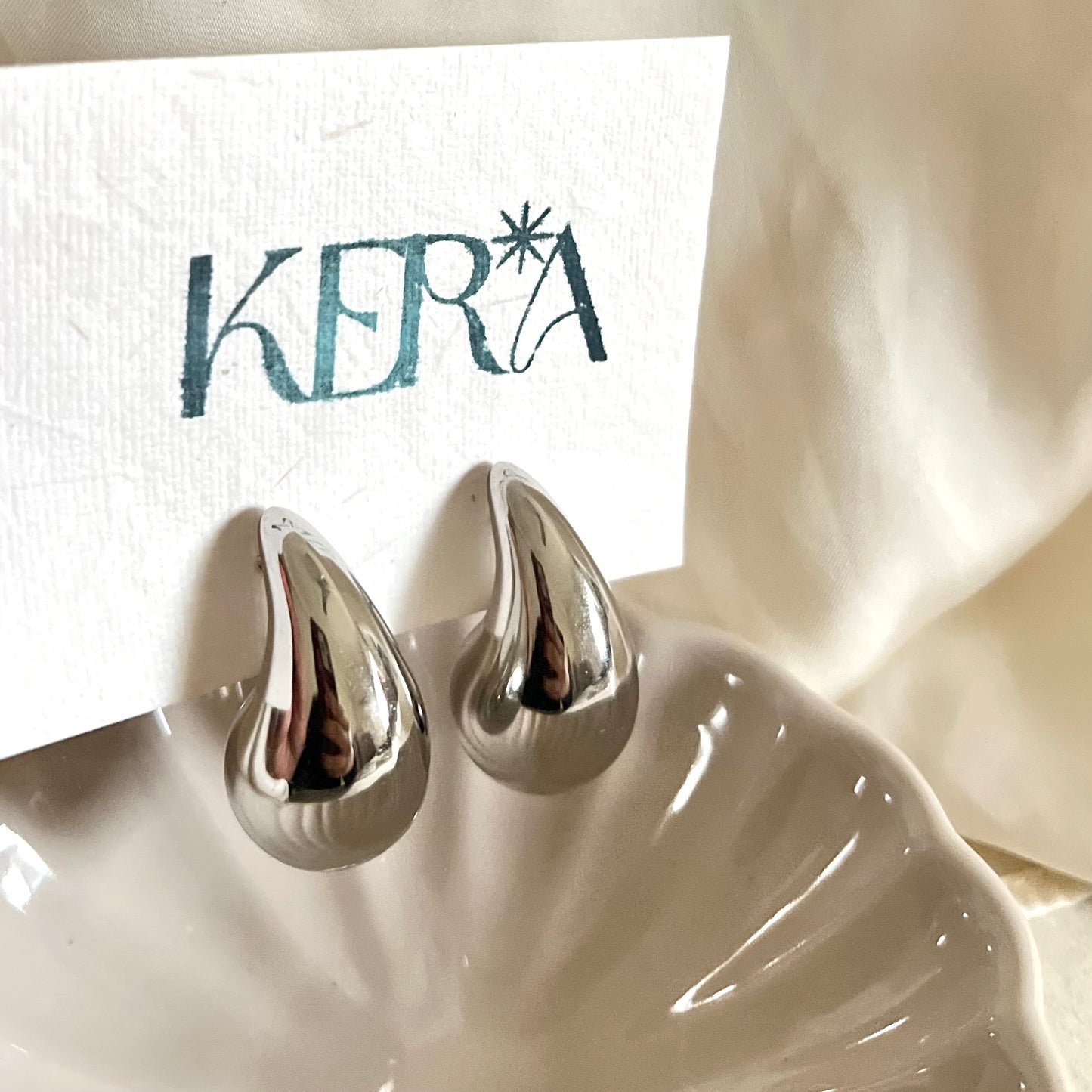 Silver toned droplet earrings